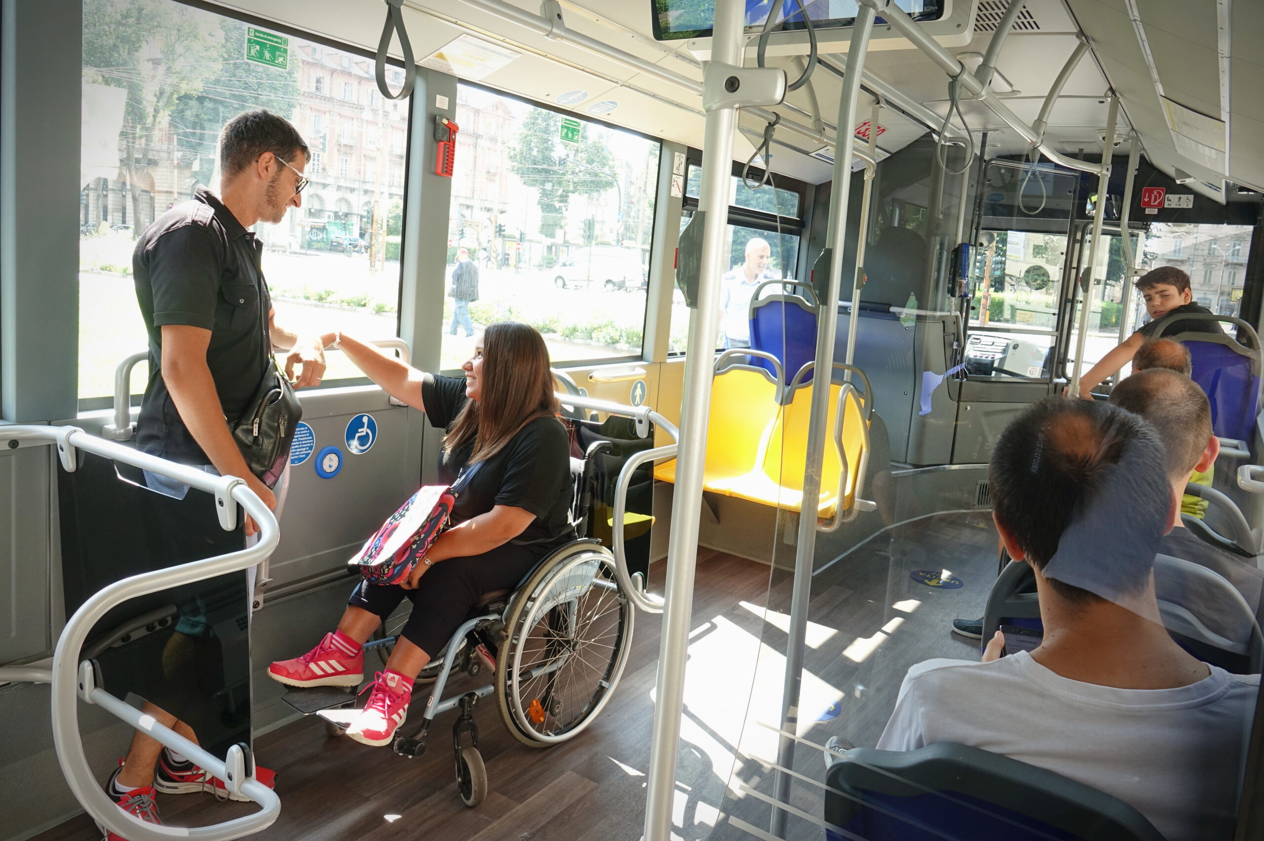 A,Girl,In,A,Wheelchair,Travels,By,Bus.,Turin,,Italy